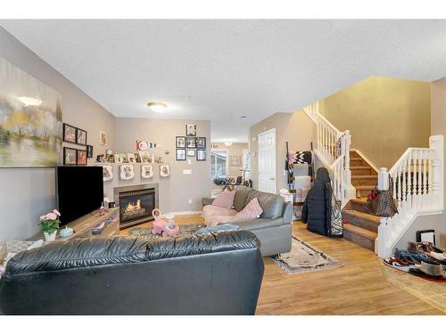 143 Saddlemont Crescent Ne, Calgary, AB - Indoor Photo Showing Living Room With Fireplace