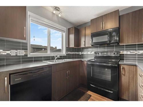 18 Evansborough Crescent Nw, Calgary, AB - Indoor Photo Showing Kitchen With Double Sink