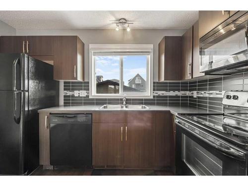 18 Evansborough Crescent Nw, Calgary, AB - Indoor Photo Showing Kitchen With Double Sink