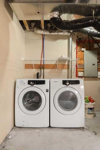 18 Evansborough Crescent Nw, Calgary, AB - Indoor Photo Showing Laundry Room