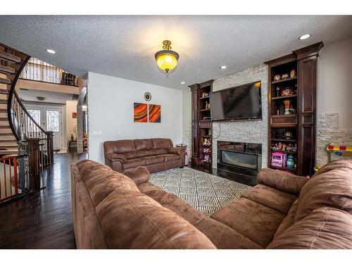 6 Taralake Cape Ne, Calgary, AB - Indoor Photo Showing Living Room With Fireplace
