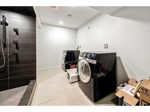 1445 Lake Ontario Drive Se, Calgary, AB - Indoor Photo Showing Laundry Room