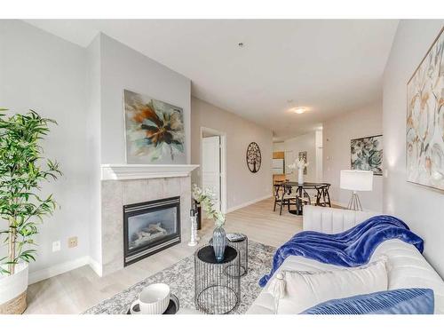 202-138 18 Avenue Se, Calgary, AB - Indoor Photo Showing Living Room With Fireplace