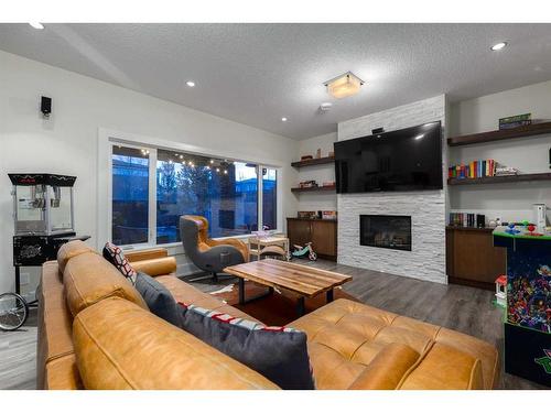 5 Aspen Summit Circle Sw, Calgary, AB - Indoor Photo Showing Living Room With Fireplace