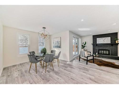11377 Braeside Drive Sw, Calgary, AB - Indoor With Fireplace