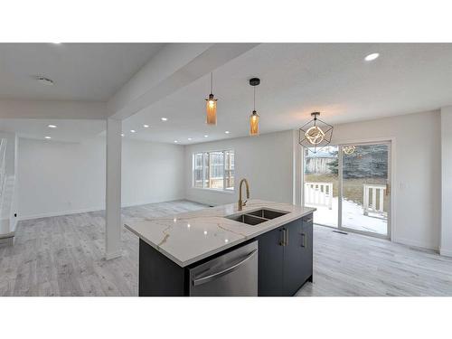 102 Somercrest Circle Sw, Calgary, AB - Indoor Photo Showing Kitchen With Double Sink