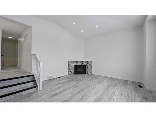 102 Somercrest Circle Sw, Calgary, AB - Indoor With Fireplace