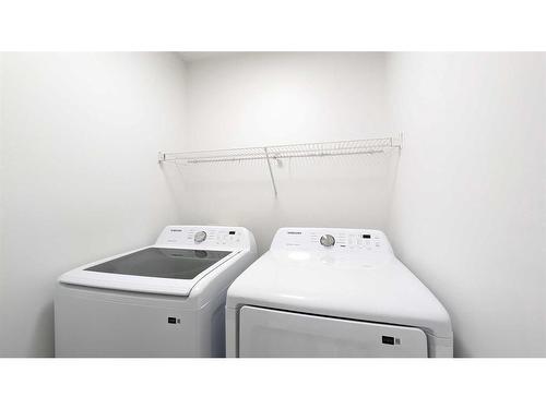 102 Somercrest Circle Sw, Calgary, AB - Indoor Photo Showing Laundry Room