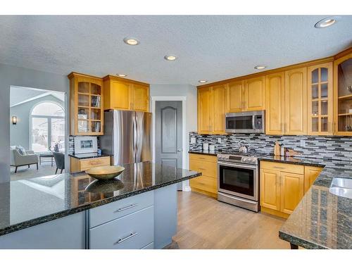 65 Sandstone Ridge Crescent, Okotoks, AB - Indoor Photo Showing Kitchen With Stainless Steel Kitchen With Upgraded Kitchen