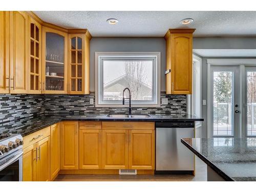 65 Sandstone Ridge Crescent, Okotoks, AB - Indoor Photo Showing Kitchen With Double Sink