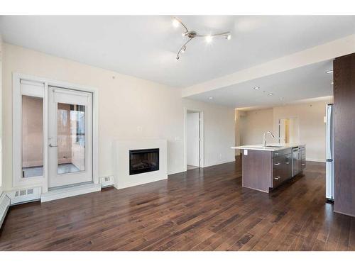 208-1730 5A Street Sw, Calgary, AB - Indoor With Fireplace