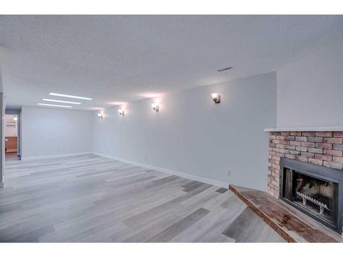3503 41 Street Sw, Calgary, AB - Indoor Photo Showing Living Room With Fireplace