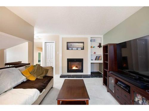 953 Ranchview Crescent Nw, Calgary, AB - Indoor Photo Showing Living Room With Fireplace