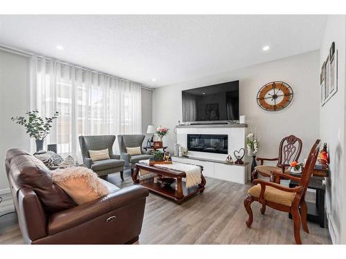33 Legacy Woods Place Se, Calgary, AB - Indoor Photo Showing Living Room With Fireplace