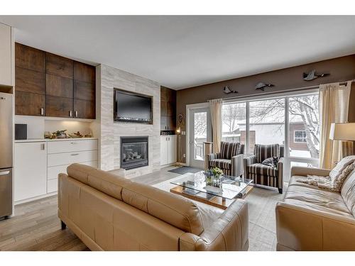 1023 2 Avenue Nw, Calgary, AB - Indoor Photo Showing Living Room With Fireplace