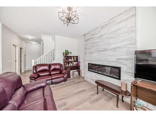 178 Aquila Way Nw, Calgary, AB - Indoor Photo Showing Living Room With Fireplace