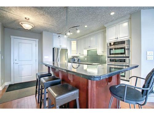 902-1726 14 Avenue Nw, Calgary, AB - Indoor Photo Showing Kitchen With Stainless Steel Kitchen With Upgraded Kitchen