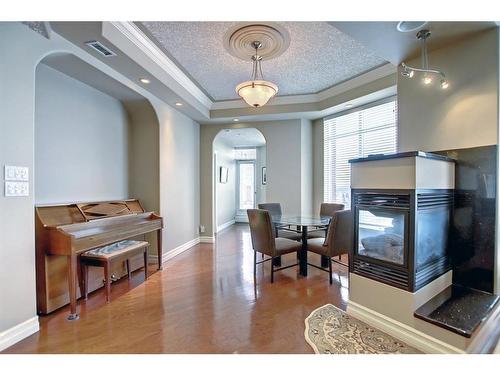 902-1726 14 Avenue Nw, Calgary, AB - Indoor With Fireplace