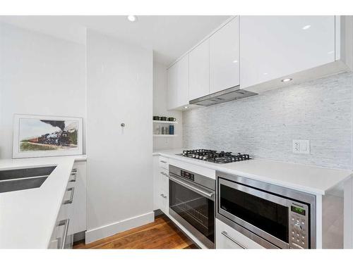 1807-1025 5 Avenue Sw, Calgary, AB - Indoor Photo Showing Kitchen With Double Sink With Upgraded Kitchen