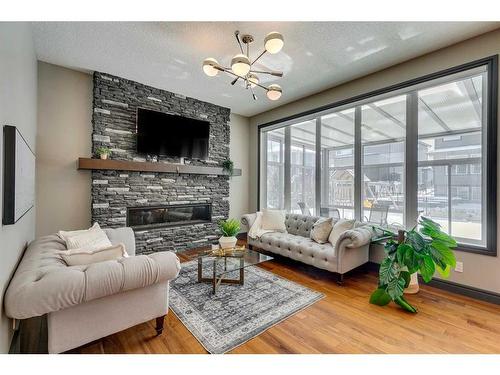 183 Auburn Sound Manor Se, Calgary, AB - Indoor Photo Showing Living Room With Fireplace