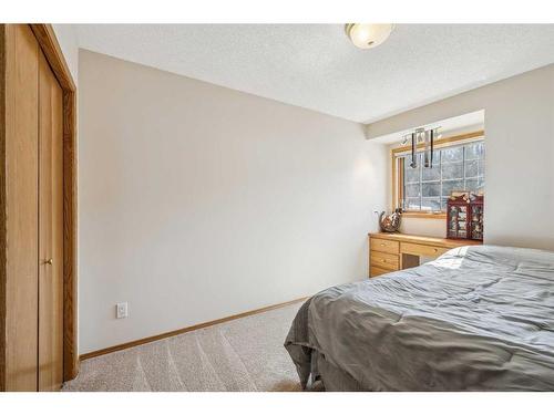 83 Riverview Circle, Cochrane, AB - Indoor Photo Showing Bedroom