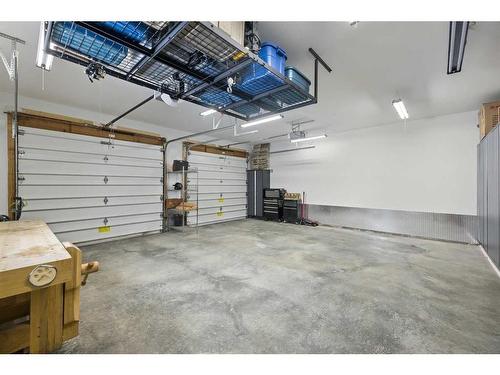83 Riverview Circle, Cochrane, AB - Indoor Photo Showing Garage