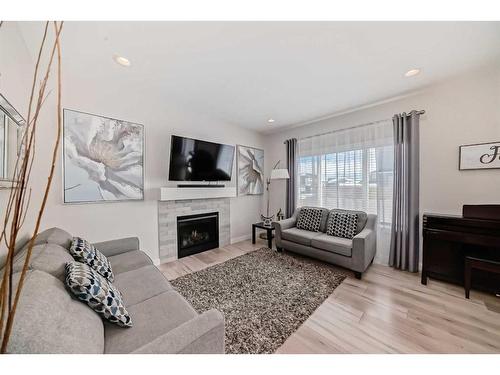 476 Bayview Way, Airdrie, AB - Indoor Photo Showing Living Room With Fireplace