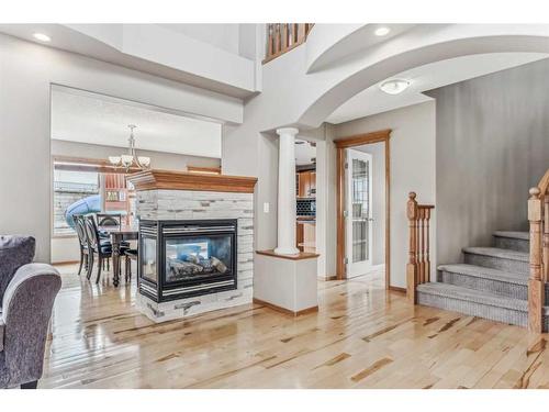 159 Evanscove Heights Nw, Calgary, AB - Indoor Photo Showing Other Room With Fireplace