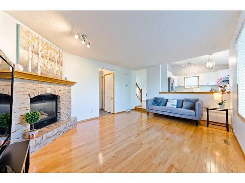 145 Macewan Park Rise Nw, Calgary, AB - Indoor Photo Showing Living Room With Fireplace