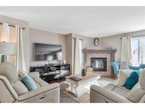 37 Everwillow Park Sw, Calgary, AB - Indoor Photo Showing Living Room With Fireplace