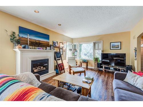 1328 7A Street Nw, Calgary, AB - Indoor Photo Showing Living Room With Fireplace