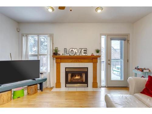 2235 6 Avenue Nw, Calgary, AB - Indoor Photo Showing Living Room With Fireplace