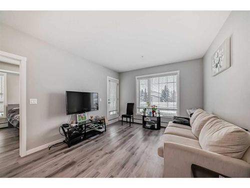 207-200 Shawnee Square Sw, Calgary, AB - Indoor Photo Showing Living Room