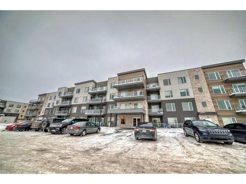 207-200 Shawnee Square Sw, Calgary, AB - Outdoor With Balcony With Facade