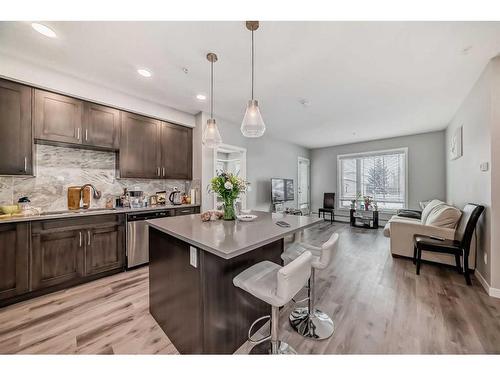 207-200 Shawnee Square Sw, Calgary, AB - Indoor Photo Showing Kitchen With Upgraded Kitchen