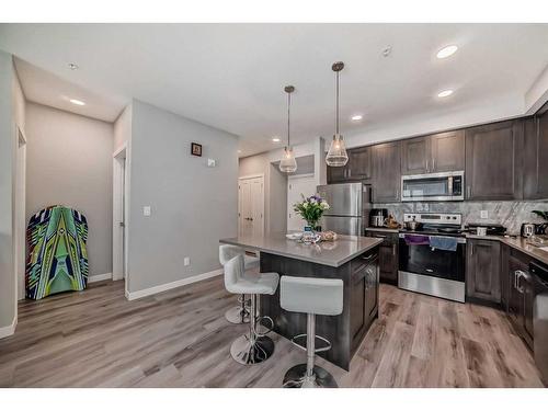 207-200 Shawnee Square Sw, Calgary, AB - Indoor Photo Showing Kitchen With Stainless Steel Kitchen With Upgraded Kitchen