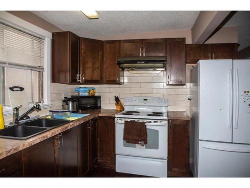 6115 Penbrooke Drive Se, Calgary, AB - Indoor Photo Showing Kitchen With Double Sink