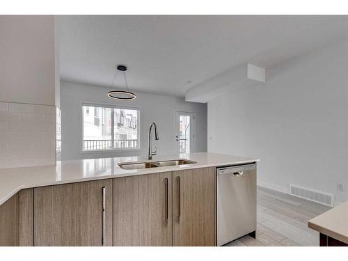 801-335 Creekside Boulevard Sw, Calgary, AB - Indoor Photo Showing Kitchen With Double Sink
