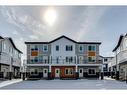 801-335 Creekside Boulevard Sw, Calgary, AB  - Outdoor With Balcony With Facade 
