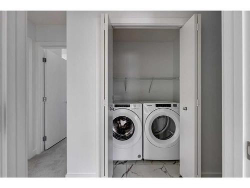 801-335 Creekside Boulevard Sw, Calgary, AB - Indoor Photo Showing Laundry Room