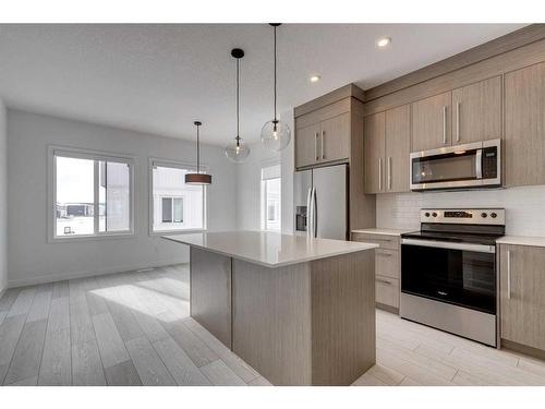 801-335 Creekside Boulevard Sw, Calgary, AB - Indoor Photo Showing Kitchen With Stainless Steel Kitchen With Upgraded Kitchen