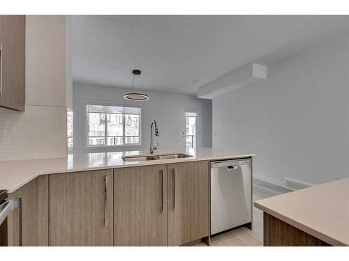 802-335 Creekside Boulevard Sw, Calgary, AB - Indoor Photo Showing Kitchen With Double Sink