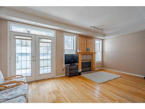 1204 5 Avenue Nw, Calgary, AB - Indoor Photo Showing Other Room With Fireplace