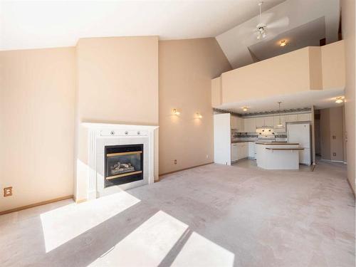 94 Somervale Point Sw, Calgary, AB - Indoor Photo Showing Living Room With Fireplace