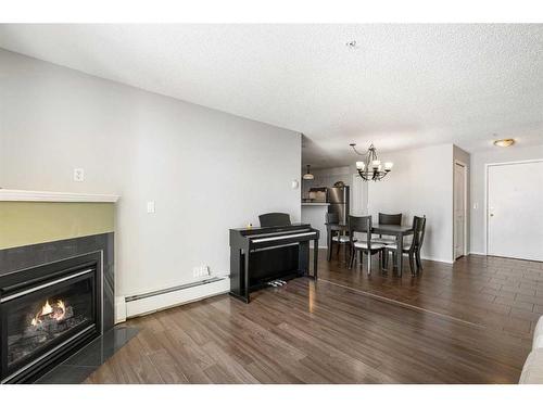 3314-1620 70 Street Se, Calgary, AB - Indoor Photo Showing Living Room With Fireplace