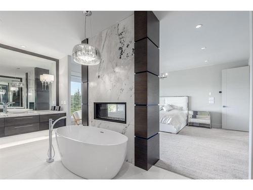 125 Aspen Ridge Heights Sw, Calgary, AB - Indoor Photo Showing Bathroom With Fireplace