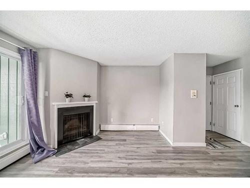 5310-315 Southampton Drive Sw, Calgary, AB - Indoor Photo Showing Other Room With Fireplace