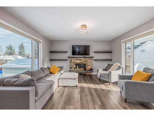 9816 Palistone Road Sw, Calgary, AB - Indoor Photo Showing Living Room With Fireplace