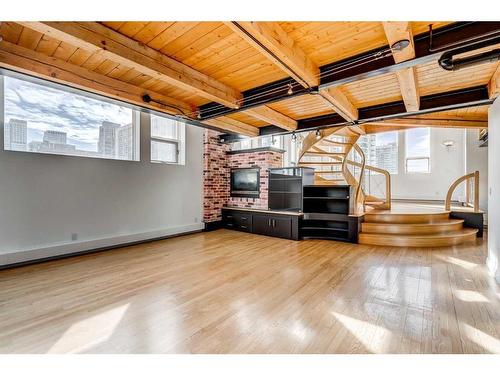 313-1117 1 Street Sw, Calgary, AB - Indoor With Fireplace
