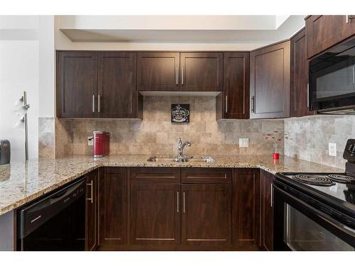 1134-1540 Sherwood Boulevard Nw, Calgary, AB - Indoor Photo Showing Kitchen With Double Sink With Upgraded Kitchen
